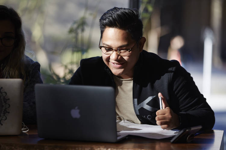 Hospitality student working on computer
